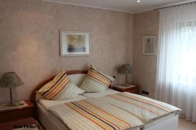Ein Bett oder Betten in einem Zimmer der Unterkunft Ferienwohnungen Arnold