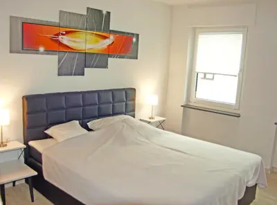 Ein Bett oder Betten in einem Zimmer der Unterkunft Ferienwohnungen Arnold