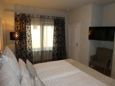 Ein Bett oder Betten in einem Zimmer der Unterkunft Rathausplatz Nr. 9