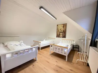 Ein Bett oder Betten in einem Zimmer der Unterkunft 3-Zimmer Haus 85qm mit Balkon bis zu 8 Personen