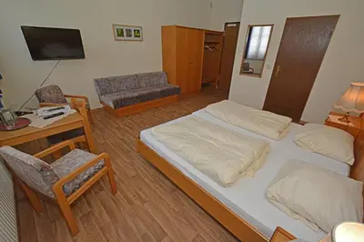 Ein Bett oder Betten in einem Zimmer der Unterkunft Weinhaus Hehner-Kiltz