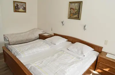 Ein Bett oder Betten in einem Zimmer der Unterkunft Weinhaus Hehner-Kiltz