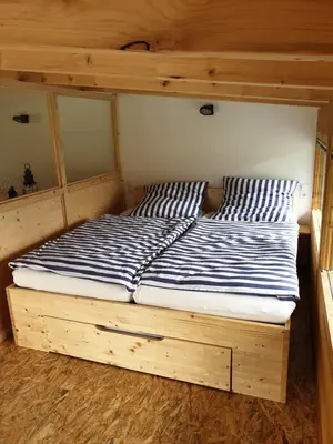 Ein Bett oder Betten in einem Zimmer der Unterkunft Beim Hooch. Lisbeth