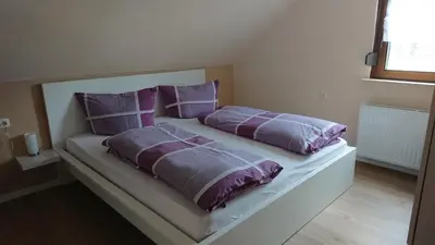 Ein Bett oder Betten in einem Zimmer der Unterkunft Weingut Bollig-Prüm