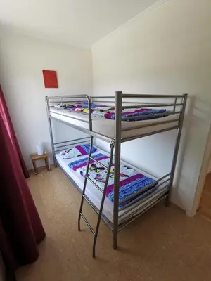 Ein Bett oder Betten in einem Zimmer der Unterkunft Ferienwohnung zum Bätstän