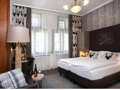 Ein Bett oder Betten in einem Zimmer der Unterkunft Hotel am Markt Bacharach