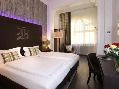 Ein Bett oder Betten in einem Zimmer der Unterkunft Hotel am Markt Bacharach