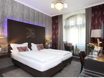 Ein Bett oder Betten in einem Zimmer der Unterkunft Hotel am Markt Bacharach