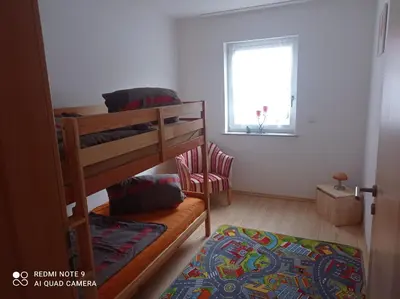 Ein Bett oder Betten in einem Zimmer der Unterkunft Ferienwohnung Idarblick
