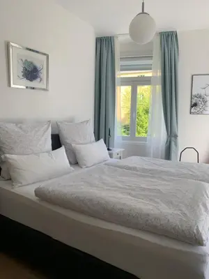 Ein Bett oder Betten in einem Zimmer der Unterkunft Ferienwohnung Heuser
