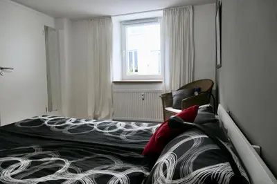 Ein Bett oder Betten in einem Zimmer der Unterkunft Wohnen am Trierer Moselufer