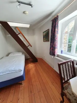 Ein Bett oder Betten in einem Zimmer der Unterkunft Kutscherhaus auf der Sauerburg