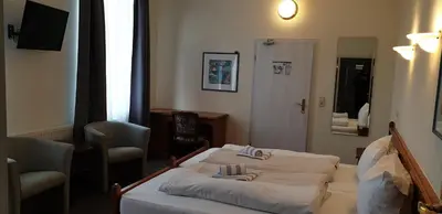 Ein Bett oder Betten in einem Zimmer der Unterkunft Eifeler Hof - Ihr Restaurant für Genussmomente in Kyllburg
