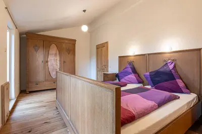 Ein Bett oder Betten in einem Zimmer der Unterkunft Nengshof Ferienhaus Glockenblume