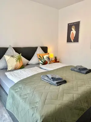 Ein Bett oder Betten in einem Zimmer der Unterkunft Ferienwohnung Bloom