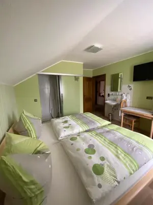 Ein Bett oder Betten in einem Zimmer der Unterkunft Pension Görgen