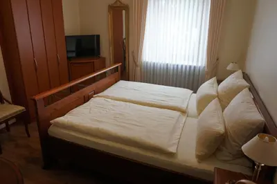 Ein Bett oder Betten in einem Zimmer der Unterkunft Landgasthof “Zur Alten Mühle“