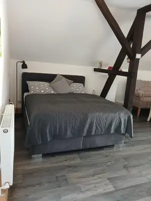 Ein Bett oder Betten in einem Zimmer der Unterkunft Ferienwohnung Axcher Hof