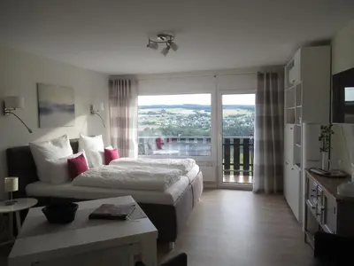 Ein Bett oder Betten in einem Zimmer der Unterkunft Loreley Lounge