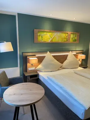 Ein Bett oder Betten in einem Zimmer der Unterkunft Weinhaus Gräfen