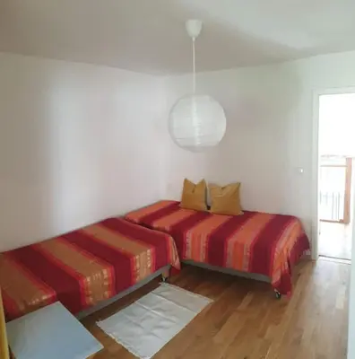 Ein Bett oder Betten in einem Zimmer der Unterkunft Moderne Wohnung mit Studio in Bauernhausscheune am See