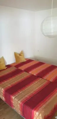 Ein Bett oder Betten in einem Zimmer der Unterkunft Moderne Wohnung mit Studio in Bauernhausscheune am See