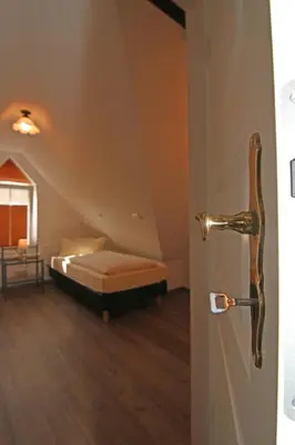 Ein Bett oder Betten in einem Zimmer der Unterkunft Ferienweingut Villa Hausmann