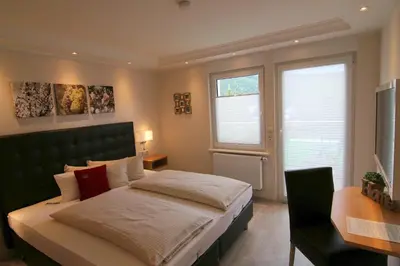Ein Bett oder Betten in einem Zimmer der Unterkunft Ferienweingut Villa Hausmann