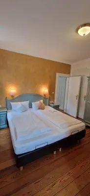 Ein Bett oder Betten in einem Zimmer der Unterkunft Ferienweingut Villa Hausmann