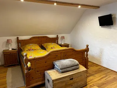 Ein Bett oder Betten in einem Zimmer der Unterkunft Ferienhaus Göbel´s gute Stube