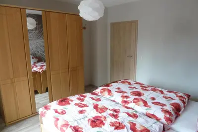 Ein Bett oder Betten in einem Zimmer der Unterkunft Ferienwohnung Haus Handwerk