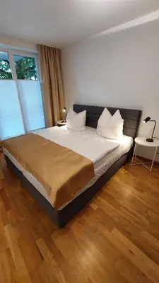 Ein Bett oder Betten in einem Zimmer der Unterkunft Ferienresidenz Brauneberger Hof an der Mosel nahe Bernkastel-Kues