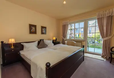 Ein Bett oder Betten in einem Zimmer der Unterkunft Ferienresidenz Brauneberger Hof an der Mosel nahe Bernkastel-Kues