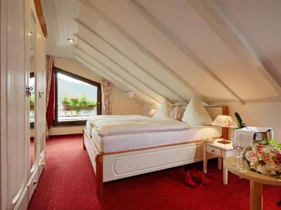 Ein Bett oder Betten in einem Zimmer der Unterkunft Ringhotel Bömers Mosel Landhotel