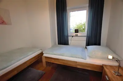 Ein Bett oder Betten in einem Zimmer der Unterkunft Ferienwohnung Heideblick