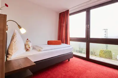 Ein Bett oder Betten in einem Zimmer der Unterkunft Hotel Schoos