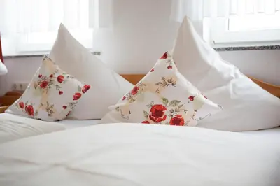 Ein Bett oder Betten in einem Zimmer der Unterkunft Hotel Schoos