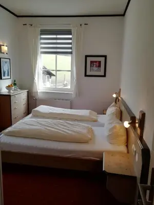 Ein Bett oder Betten in einem Zimmer der Unterkunft Waldhotel Forsthaus Remstecken