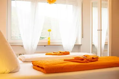Ein Bett oder Betten in einem Zimmer der Unterkunft Hotel Emmerich