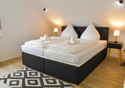 Ein Bett oder Betten in einem Zimmer der Unterkunft Hotel Emmerich
