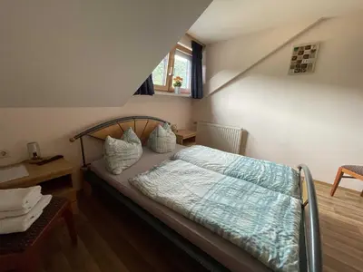 Ein Bett oder Betten in einem Zimmer der Unterkunft Hotel Zur Mosel