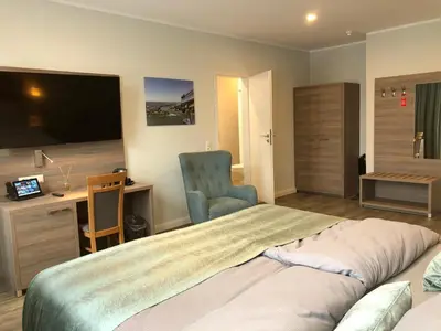 Ein Bett oder Betten in einem Zimmer der Unterkunft AKZENT Hotel Restaurant Roter Ochse Rhens bei Koblenz