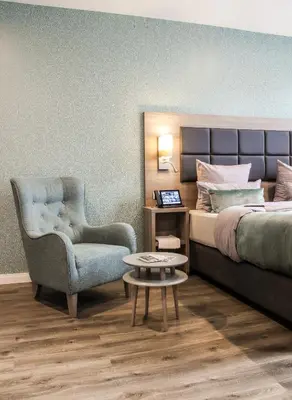 Ein Bett oder Betten in einem Zimmer der Unterkunft AKZENT Hotel Restaurant Roter Ochse Rhens bei Koblenz