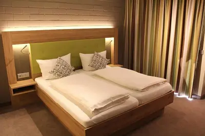 Ein Bett oder Betten in einem Zimmer der Unterkunft Hotel Sewenig