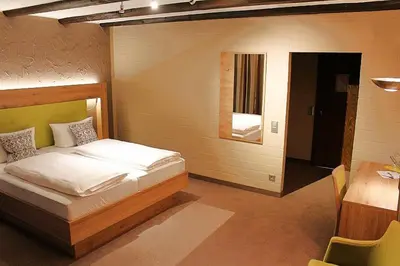 Ein Bett oder Betten in einem Zimmer der Unterkunft Hotel Sewenig