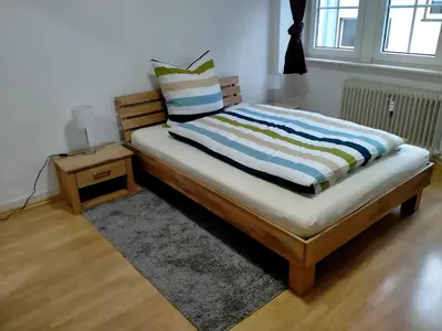 Ein Bett oder Betten in einem Zimmer der Unterkunft Ferienwohnung MacFeWo im Zentrum von Mayen - Sleep frisch renoviert