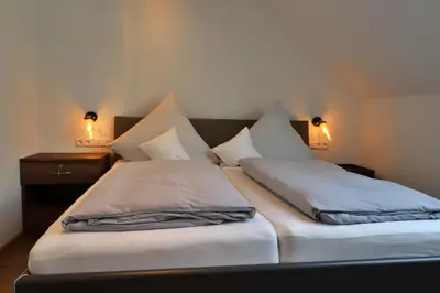 Ein Bett oder Betten in einem Zimmer der Unterkunft Gasthaus zur Post