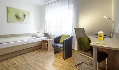 Ein Bett oder Betten in einem Zimmer der Unterkunft Hotel zum Stern