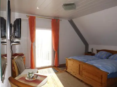 Ein Bett oder Betten in einem Zimmer der Unterkunft B&B Pension Winzerhaus Zell-Mosel