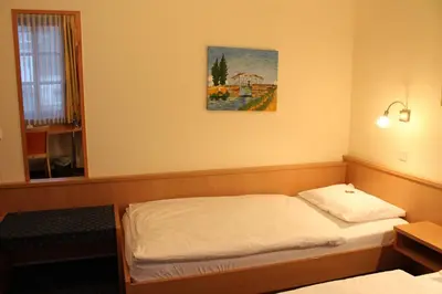 Ein Bett oder Betten in einem Zimmer der Unterkunft City Hotel Neuwied